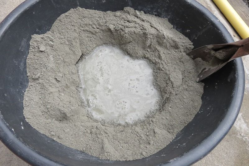 How does the hydration process of cement work and why is it crucial for strength development -image